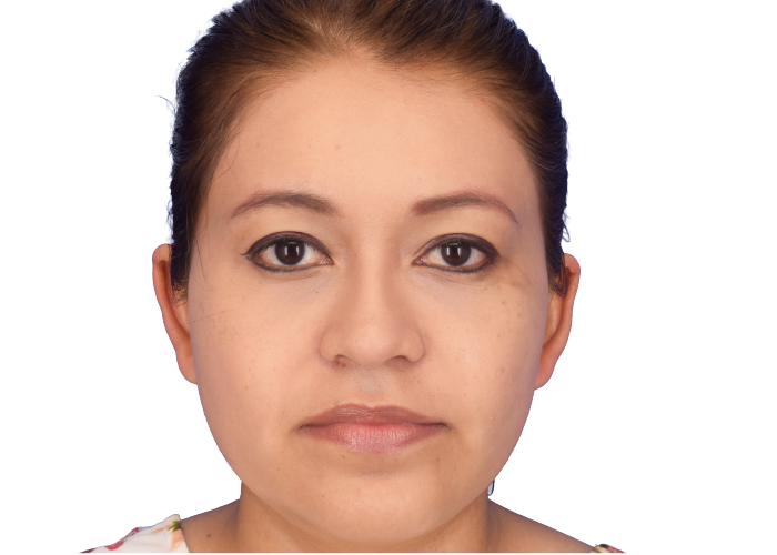 Front-facing woman with neutral expression against white background, eyes looking at the camera.