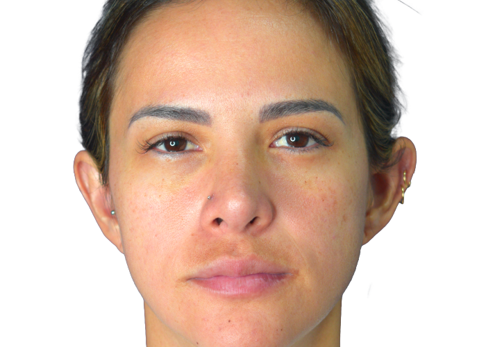 Close-up portrait of a woman facing the camera with neutral expression and a nose stud on the left nostril, against a white background.