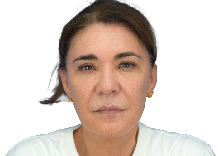 Portrait of a middle-aged woman with brown hair and gold earrings, facing the camera with a neutral expression.